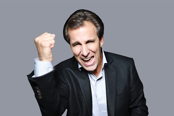 An image of Chris 'Mad Dog' Russo with his fist in the air